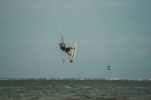 Tilted Windsurfing In Air Wallpaper