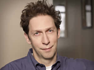 Tim Blake Nelson Posing For A Portrait Shoot Wallpaper