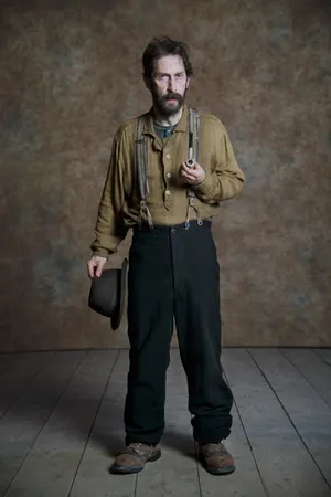 Tim Blake Nelson Posing For A Portrait Wallpaper