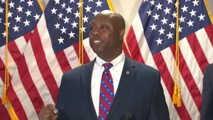 Tim Scott Standing Proudly In Front Of Three American Flags Wallpaper