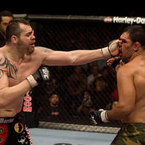 Tim Sylvia Vs Frank Mir In A Ufc Match Wallpaper