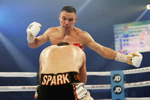 Tim Tszyu Fiercely Training In The Ring Wallpaper