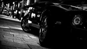 Timeless Elegance Of A Black And White Car Wallpaper