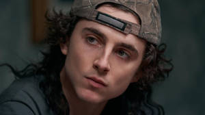 Timothée Chalamet Camouflage Hat Wallpaper