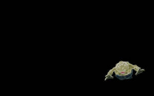 Tiny Geodude On Black Background Wallpaper