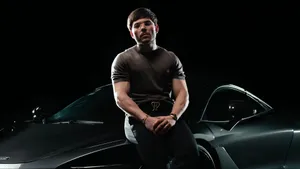 Tito Double P Stylish Car Pose Wallpaper