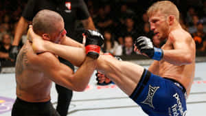 Tj Dillashaw High Kick Against Opponent Wallpaper