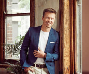 Todd Lasance Smilingin Blue Blazer Wallpaper