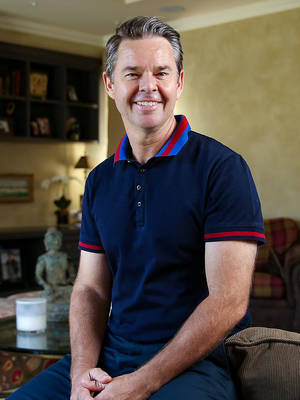 Todd Woodbridge Posing On Couch Wallpaper