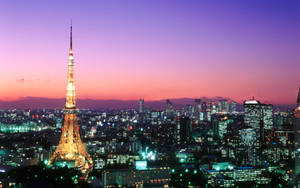 Tokyo Tower Against Purple Orange Sunset Wallpaper