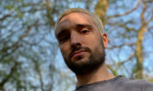 Tom Parker Posing Stylishly In A Sleek Black Suit And Tie. Wallpaper