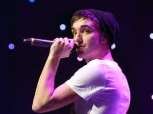 Tom Parker Striking A Pose During A Photoshoot Wallpaper