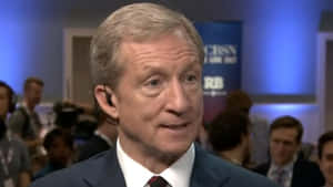 Tom Steyer In Earphones Wallpaper