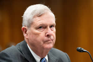 Tom Vilsack Side-eyeing Someone Wallpaper