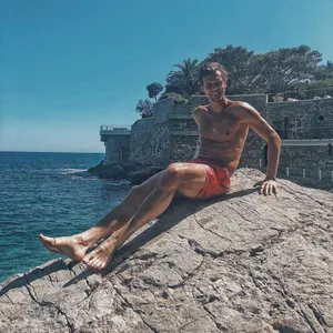 Tomas Berdych Sitting On Rock Wallpaper