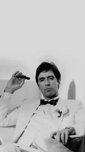 Tony Montana Relaxing With Cigar Wallpaper