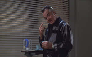 Tony Sirico Striking A Pose In A Sophisticated Suit Wallpaper