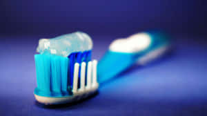 Toothbrush_with_ Blue_ Toothpaste Wallpaper