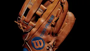Top-quality Baseball Gloves Lined Up For The Game Wallpaper