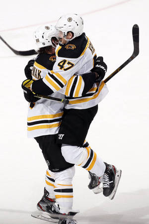 Torey Krug Hugging David Pastrnak Wallpaper