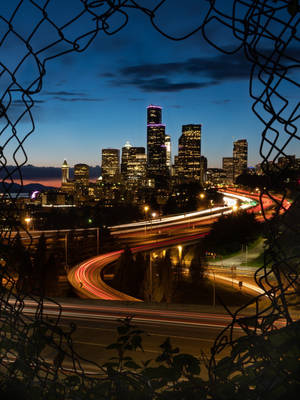 Torn Metal Mesh Seattle Skyline Wallpaper