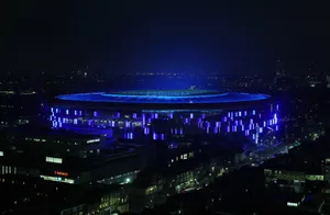 Tottenham Hotspurs Fc Stadium With Blue Lights Wallpaper