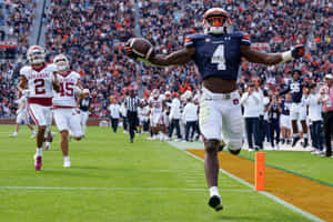 Touchdown_ Celebration_ Auburn_ Football_ Player Wallpaper