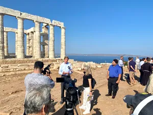 Tourists In Poseidon Temple Sounion Wallpaper