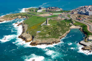 Tower Of Hercules Along Coast Above The Ocean Wallpaper