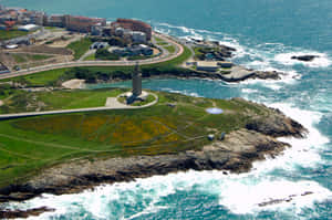 Tower Of Hercules Waves Crashing Against Shore Wallpaper