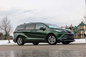 Toyota Sienna Green Parked Outdoors Wallpaper