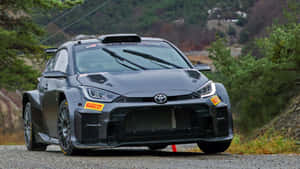 Toyota Yaris W R C Rally Car Action Wallpaper