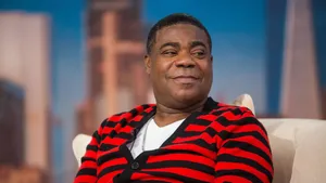 Tracy Morgan - Smiling On Stage In Front Of Camera Wallpaper