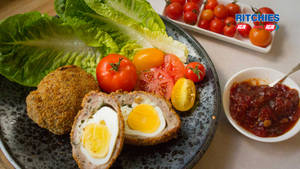 Traditional British Scotch Eggs Dish With Tomato Relish Wallpaper