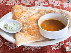 Traditional Indian Dosa With Chutney And Sambar Wallpaper