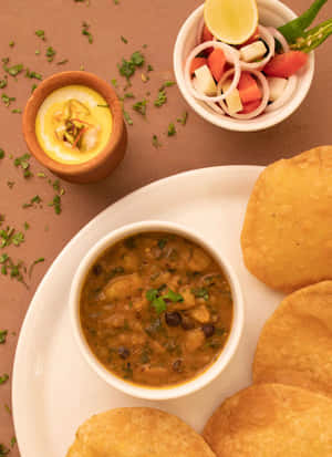 Traditional Indian Puri Chole Meal Wallpaper