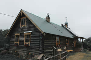 Traditional Log Cabinwith Orthodox Cross Wallpaper