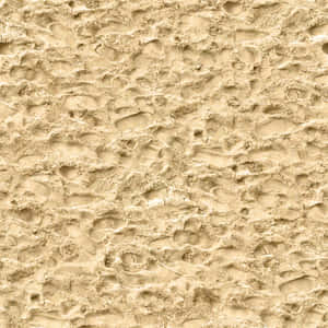 Tranquil Beach Sand With Golden Sunrays Wallpaper