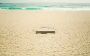 Tranquil Beach Scene On A Sunny Day Wallpaper