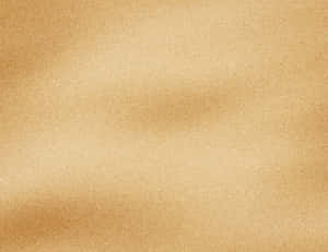 Tranquil Beach Shoreline With Golden Sand And Waves Wallpaper