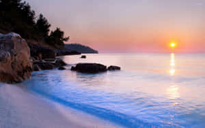 Tranquil Fiji Beach With Crystal Clear Waters And Palm Trees Wallpaper