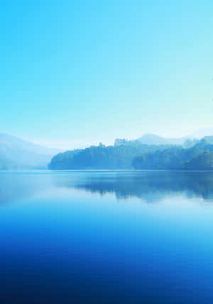 Tranquil Lake Morning Mist Wallpaper