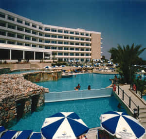 Tranquil Mediterranean Beach With Crystal Clear Waters Wallpaper