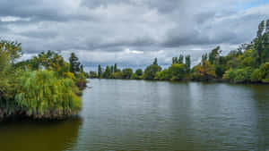 Tranquil_ River_ Scene_ Cloudy_ Sky_4 K_ U W Wallpaper