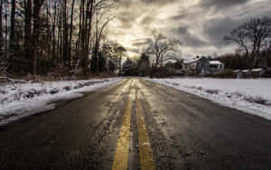 Tranquil Snow-covered Road Wallpaper