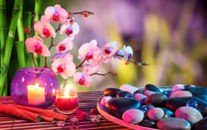 Tranquil Spa Settingwith Orchidsand Candles Wallpaper