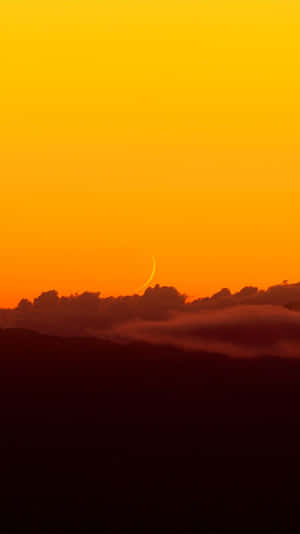 Tranquil Yellow Sunset At The Beach Wallpaper