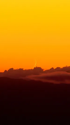 Tranquil Yellow Sunset At The Beach Wallpaper
