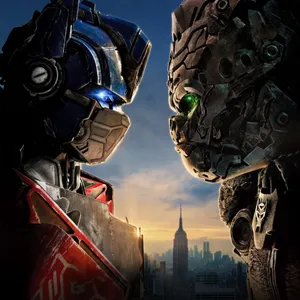 Transformers Faceoff Over Cityscape Wallpaper