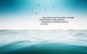 Travel Light Quote Over Ocean View Wallpaper